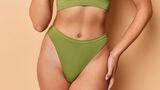 Cropped,Shot,Of,Faceless,Woman,Wears,Green,Top,And,Panties