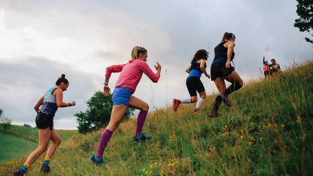 Group of female runners running in nature