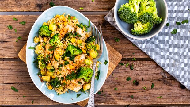 Chicken and rice stir fry with broccoli and corn
