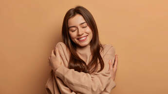 I,Love,Myself.,Pretty,Smiling,Woman,Embraces,Herself,Gently,,Expresses