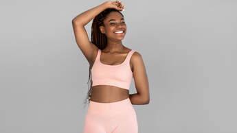 Portrait,Of,Happy,Young,Black,Woman,In,Sports,Outfit,Posing