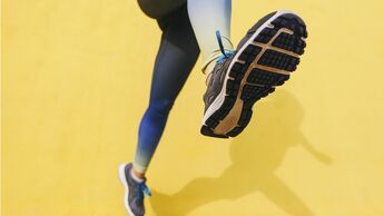 Spain, Barcelona, jogging woman, sole of shoe