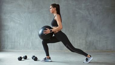 Woman,In,Stylish,Sports,Wear,Training,With,Med,Ball